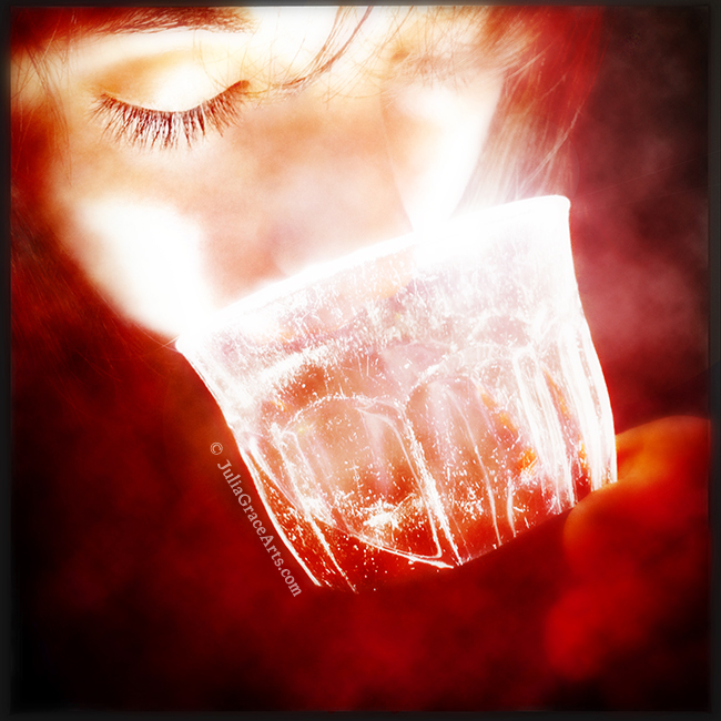 Fantasy girl drinking from glowing chalice