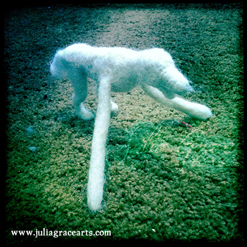 Attaching two cylinders for legs on a wool sculpture dog pet portrait