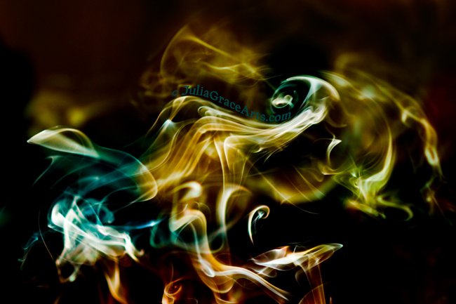 Colorful photograph of wisps and swirls of smoke