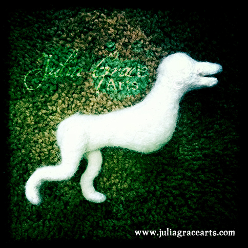 Adding and shaping the back legs of border collie needle felted sculpture