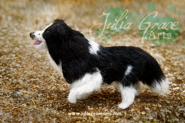 Wool sculpture border collie with raised paw