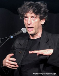 Neil Gaiman telling a dirty joke in a funny voice with a dorky face